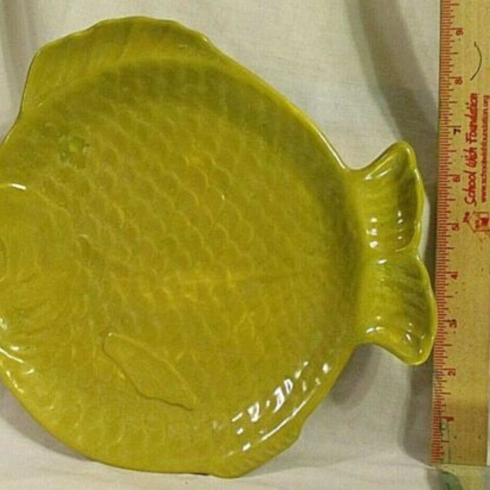 Student pottery fish plates signed Gwin Tillis